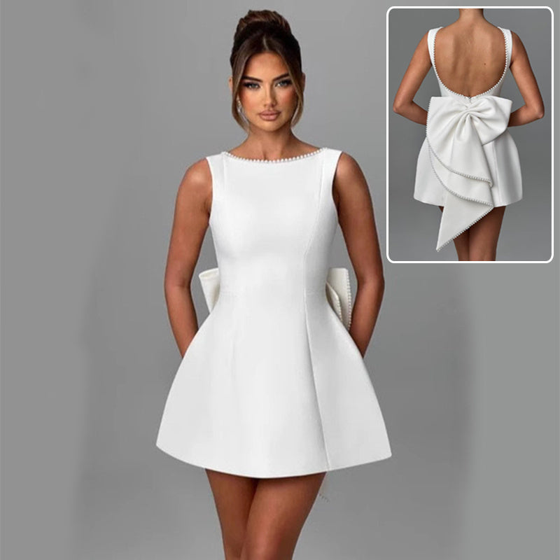 White backless A-line dress with pearl bow
