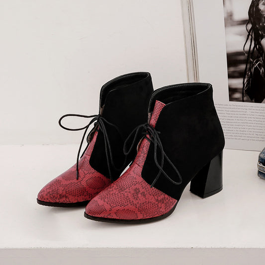 Pointy snakeskin lace-up boots