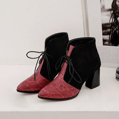 Pointy snakeskin lace-up boots