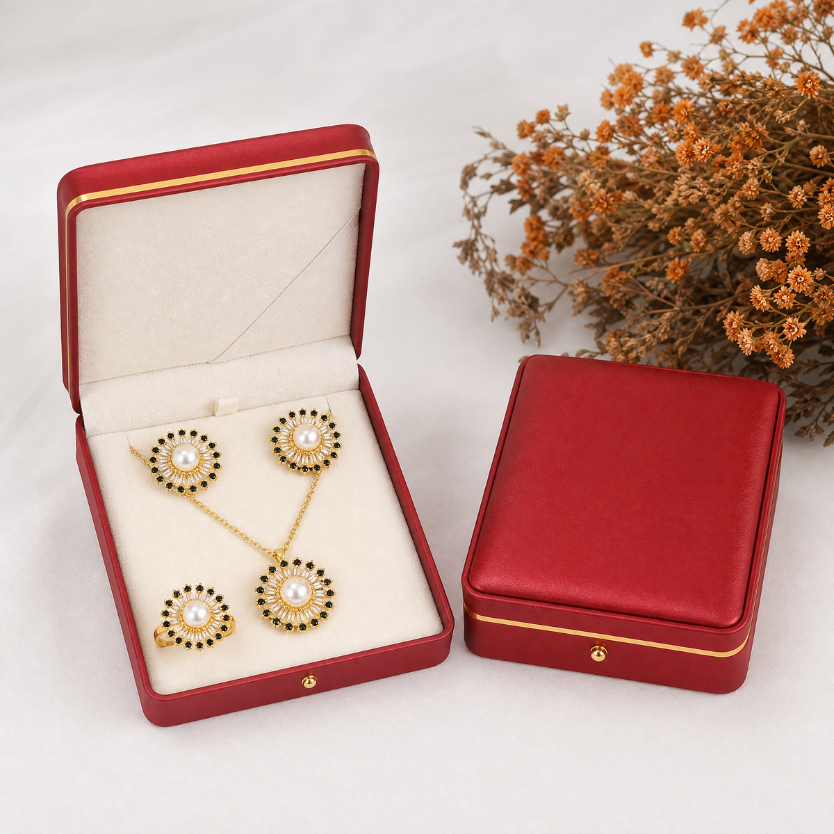 Real pearl gold sunburst jewelry set with black and clear stones