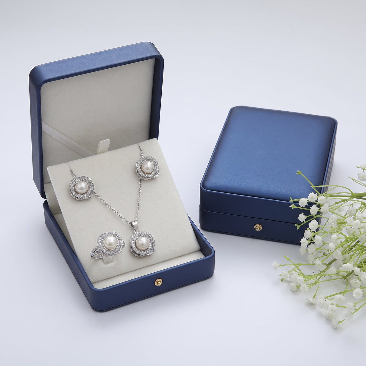 White pearl swirl rosette necklace, earrings and ring set
